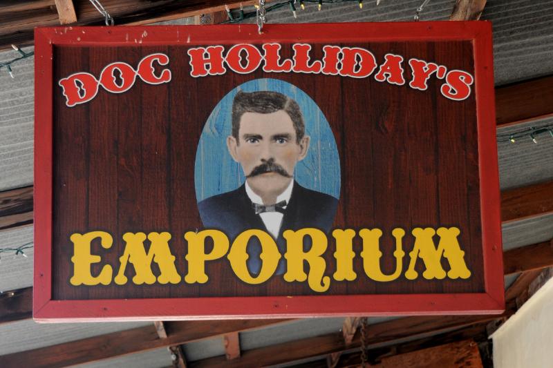 A sign hangs over the entrance to Doc Holliday's Emporium in historic Tombstone, Arizona, known as 'The Town Too Tough to Die.' 