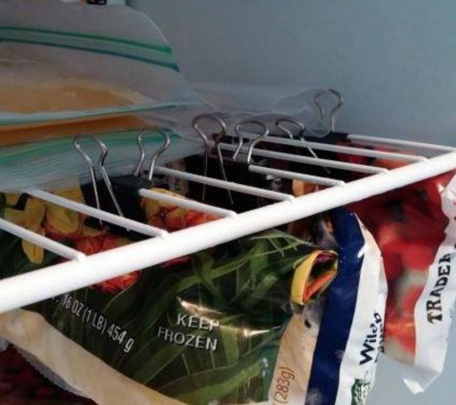 binder clips holding up frozen bags of food