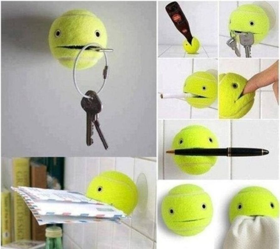 a tennis ball with a hole cut in it that looks like a mouth