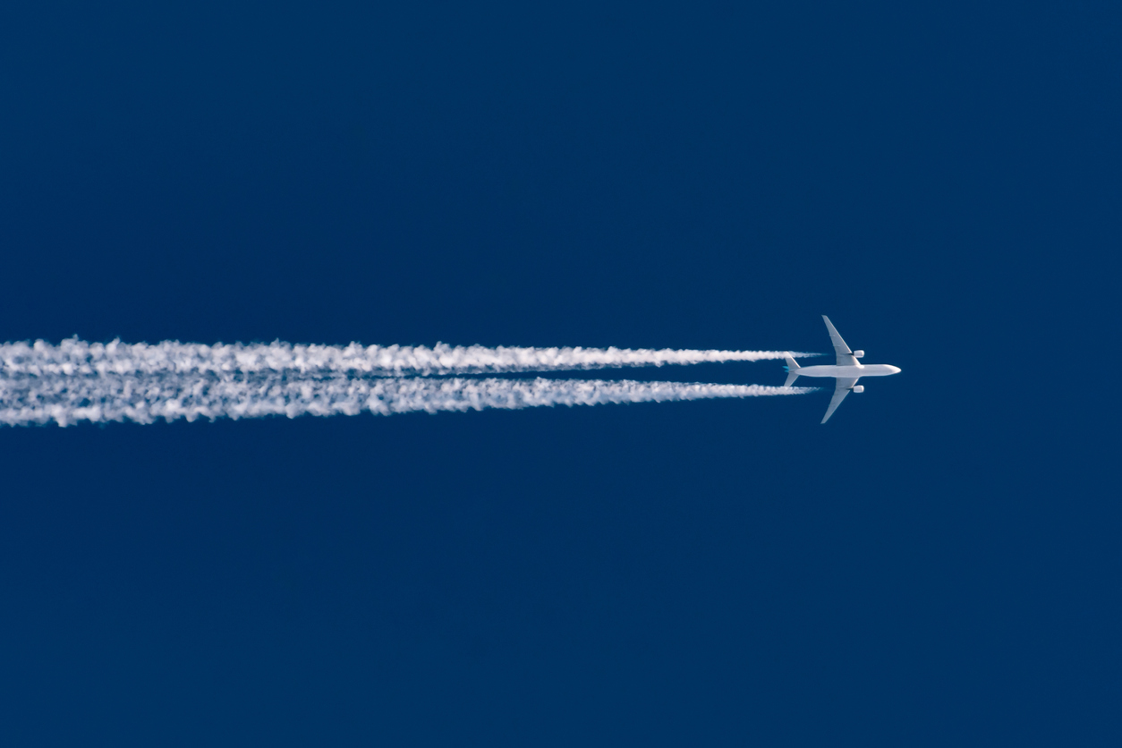 Leaving contrail trace on a clear high blue sky