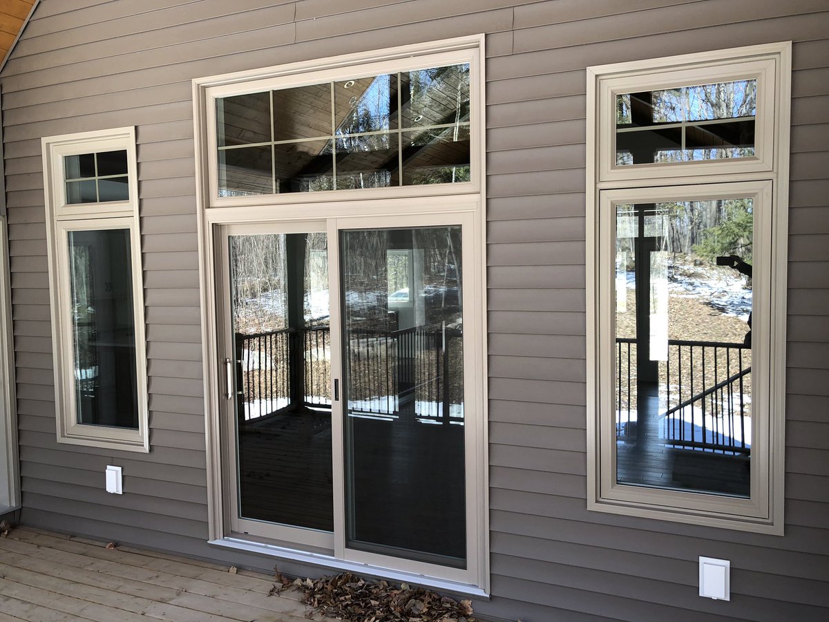 A porch door has transom windows above it.