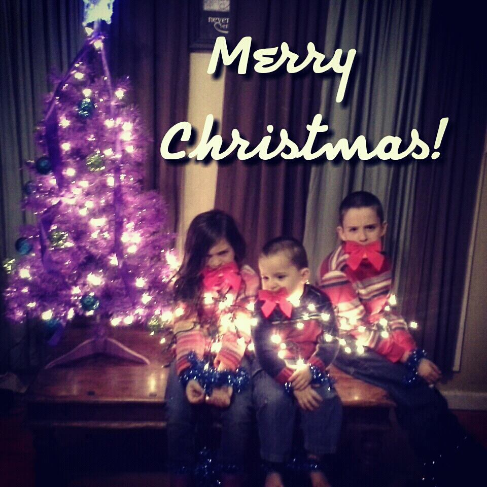 children tied up in christmas lights and gagged with bows