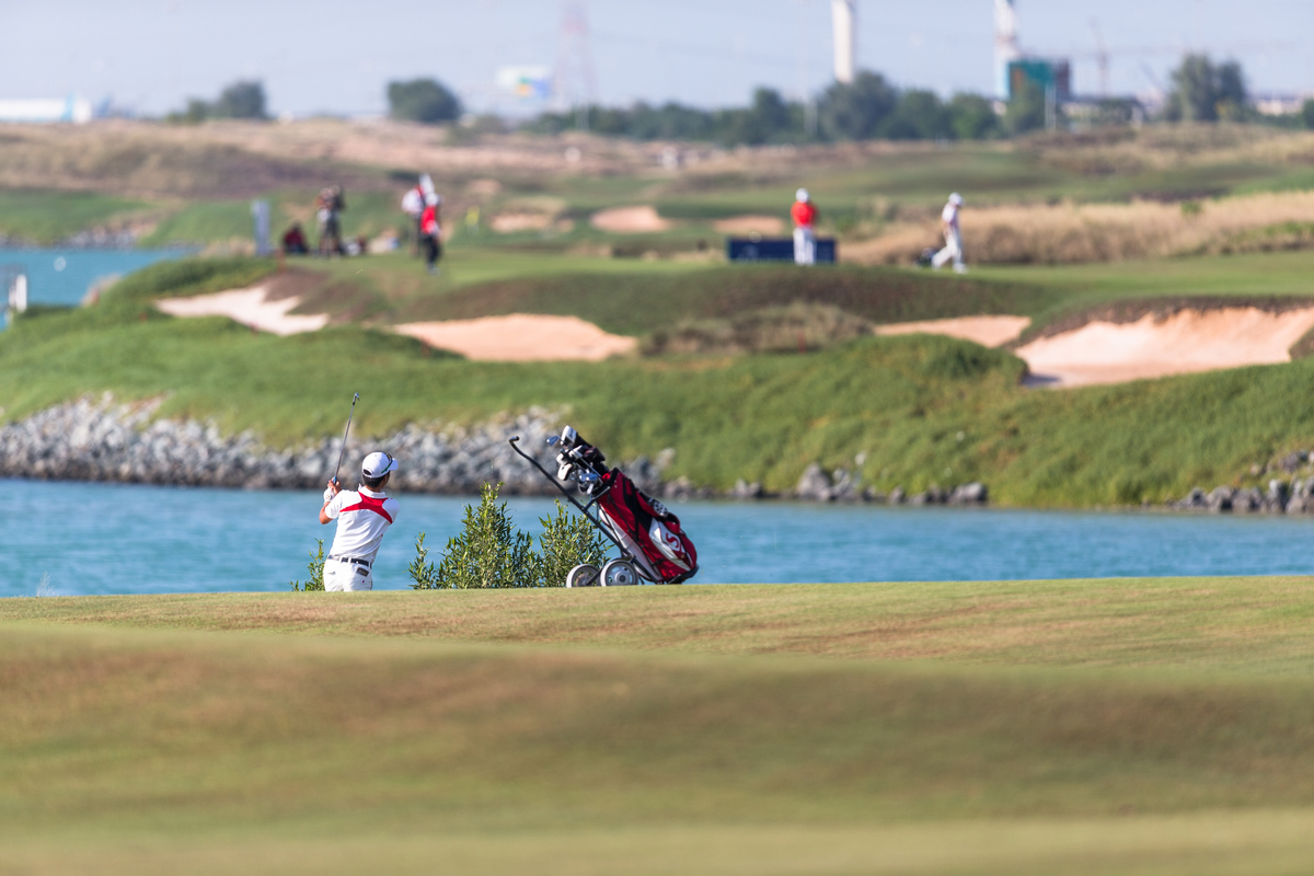 Golfers play at Yas Links in Abu Dhabi.