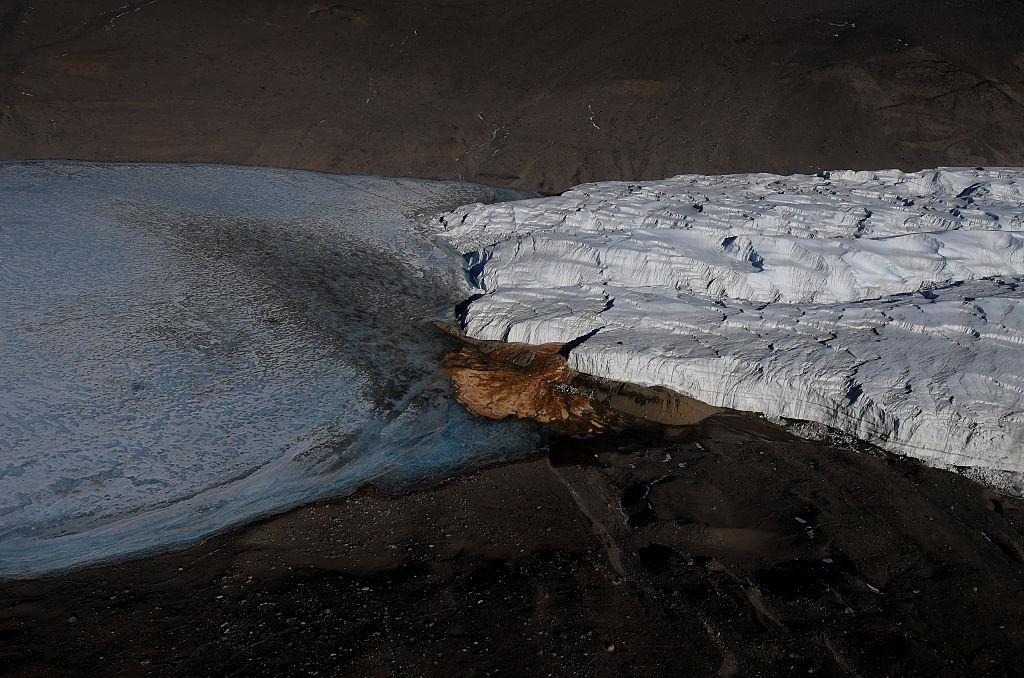 red water flows out of blood falls glacier