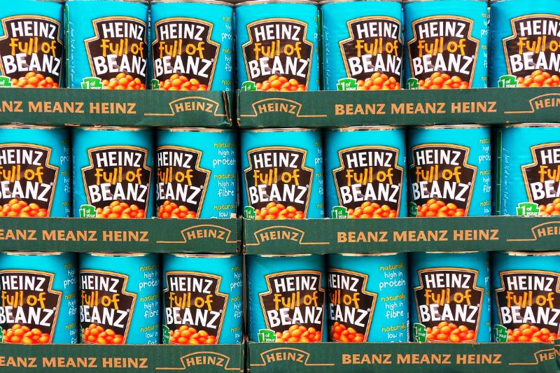A store displays shelves of Heinz beans.
