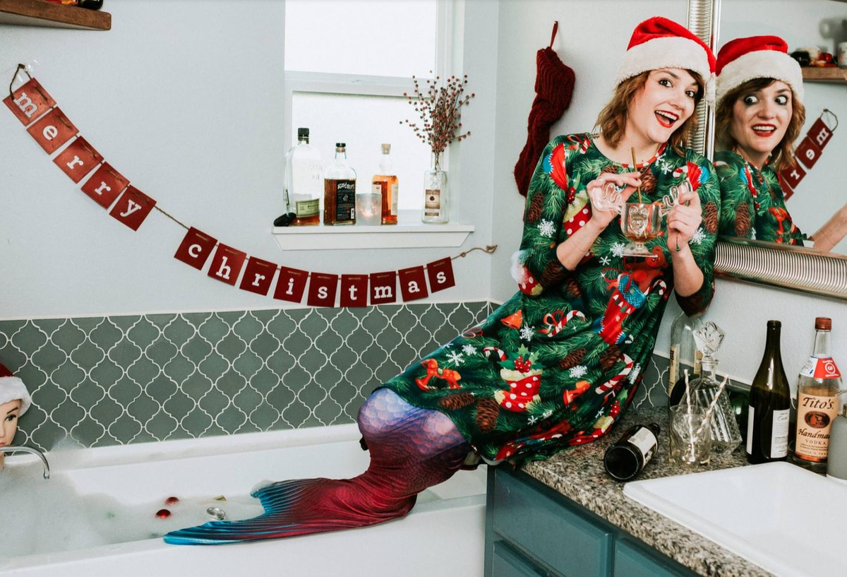 woman with mermaid tail looking generally chaotic