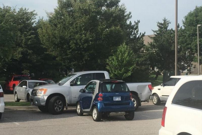 smart car blocking a truck
