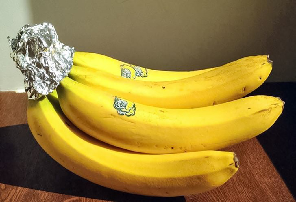 Aluminum foil wrapped around banana stem 
