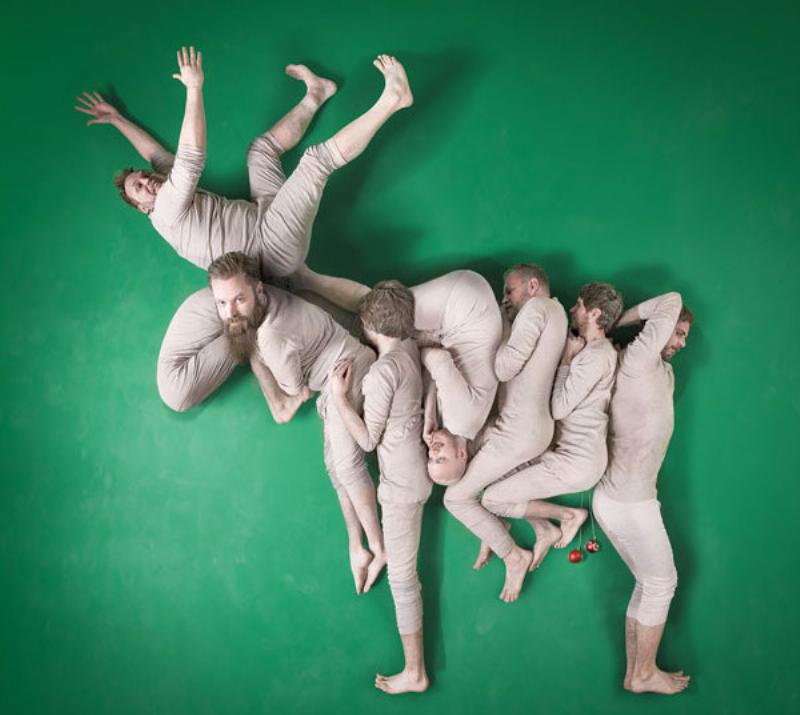 people shape bodies into a reindeer