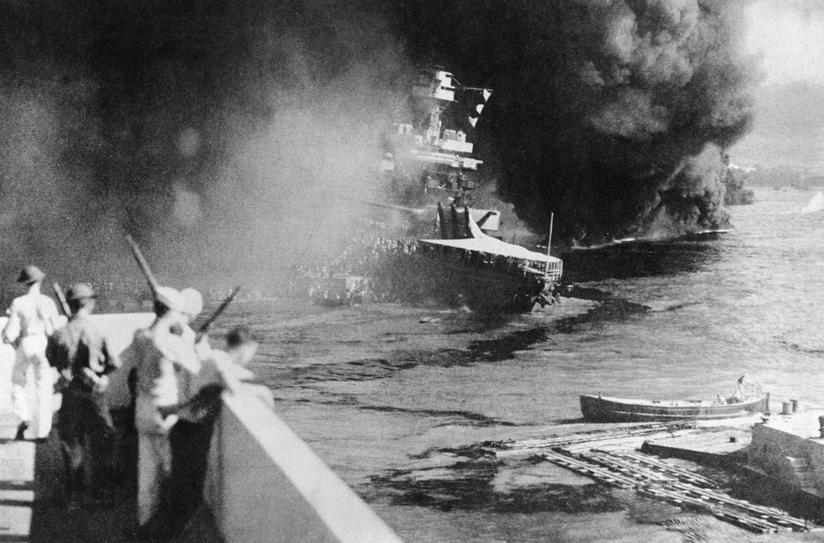 An American ship is bombed during Pearl Harbor, 1941.