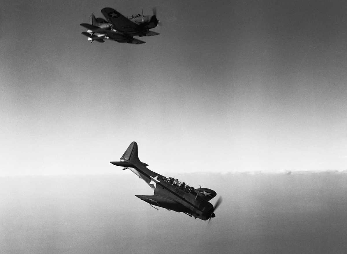 Douglas SBD Dauntless dive bombers fly above the Naval Air Station at Daytona Beach, Florida, 1942.