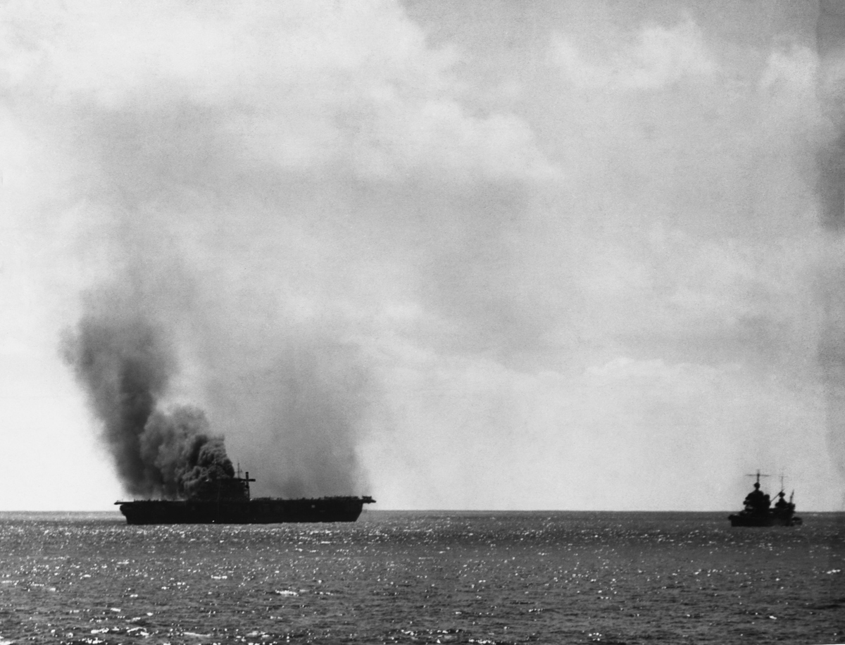 The Yorktown is damaged heavily by Japanese aircraft  on June 4, 1942 in the Battle of Midway.