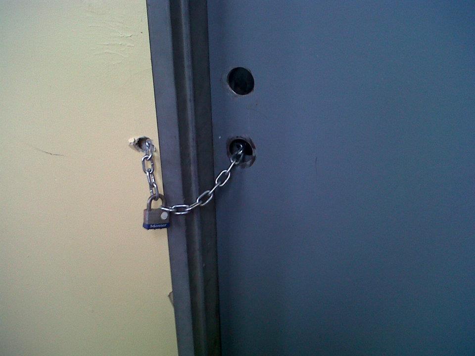 door locked with chain and lock 