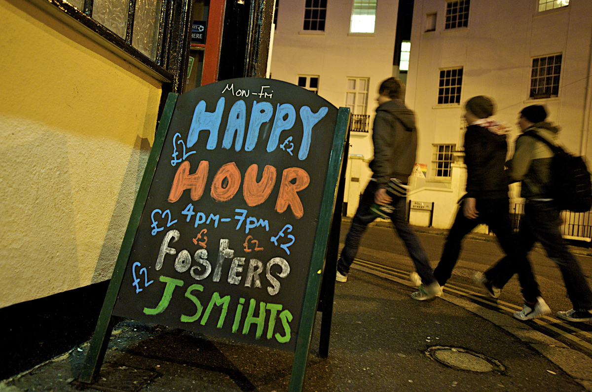 Customers head into a bar with a 