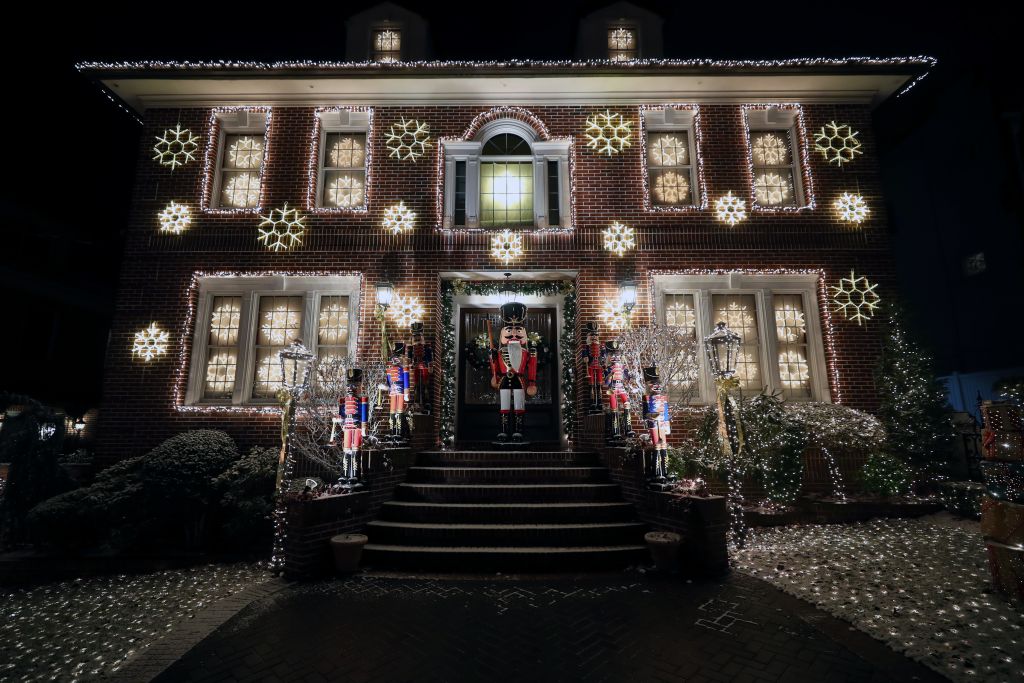 Christmas lights adorn a home's exterior.