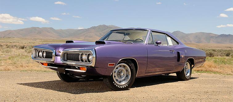 a purple car near mountains