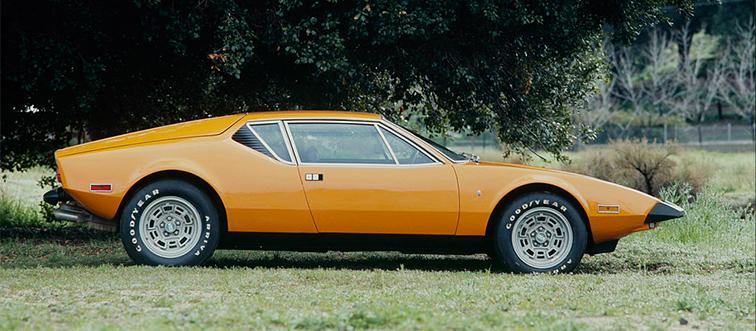 a yellow car on the grass