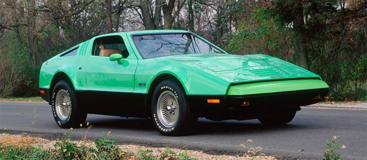 a green car driving on the road