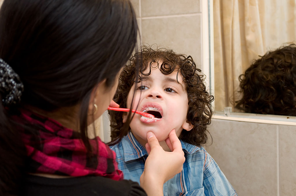 kid getting his teeth cleaned 