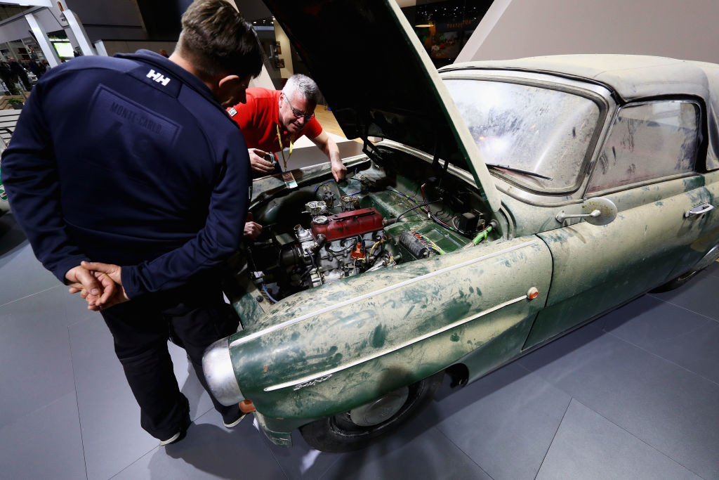 Mechanics work on a Barn Find Skoda