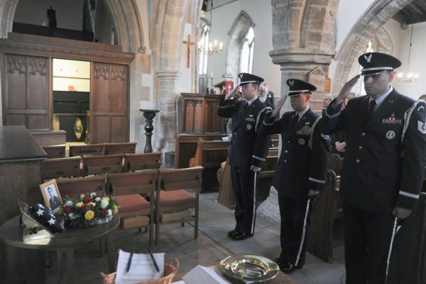 HELMDON, United Kingdom – The 422nd Air Base Group Honor Guard salutes the memorial for 10 Airmen killed when their B-17 bomber crashed in at the Astwell Castle Farms in 1943 during a memorial service in the Parish Church of St. Mary Magdalene in Helmdon Nov. 2. The ceremony honored the 327th Bombardment Squadron, VIII Bomber Command, Airmen killed Nov. 30, 1943, when they left RAF Poddington on a bombing mission to Germany. (U.S. Air Force photo by Staff Sgt. Brian Stives)