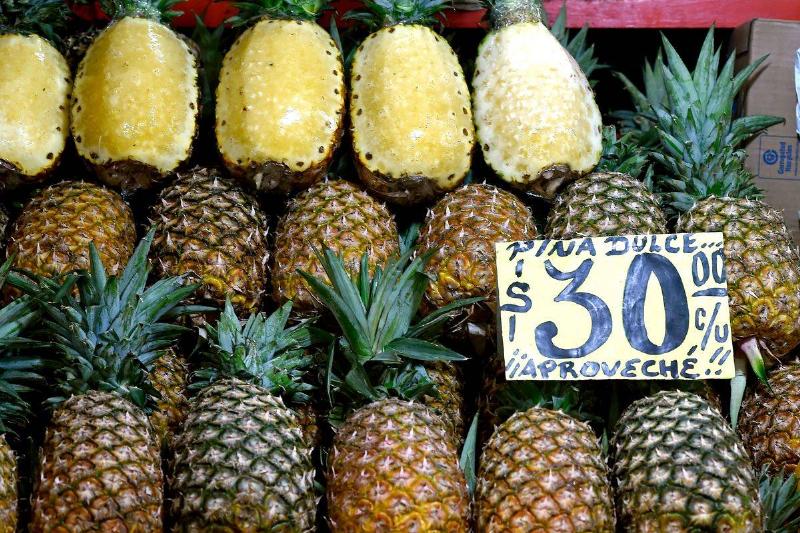 Whole pineapples are on sale at a Mexican market.