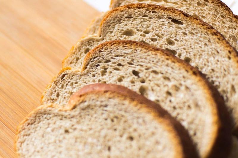 Slices of whole wheat bread are seen.