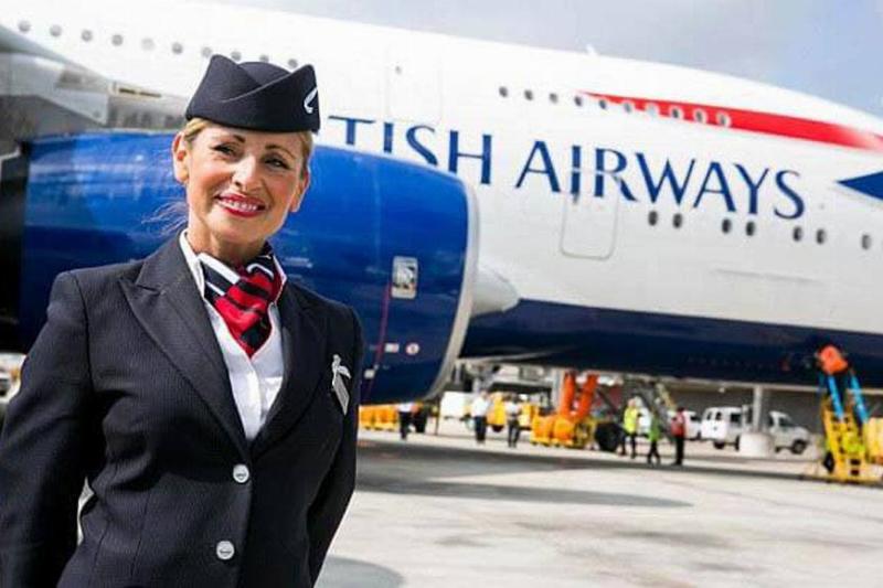 flight attendant with hands clasped