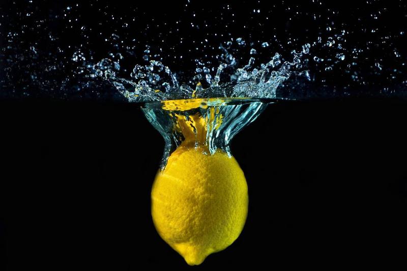 A graphic shows a lemon falling into water.
