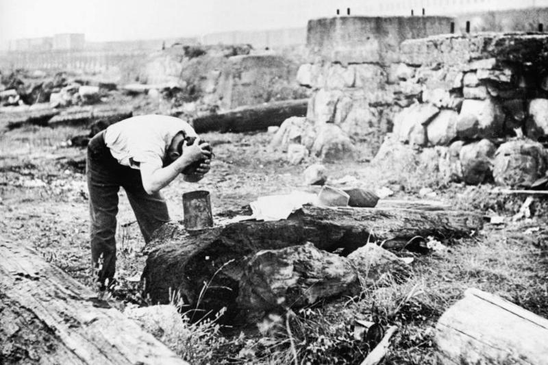 Man washing using a bucket 