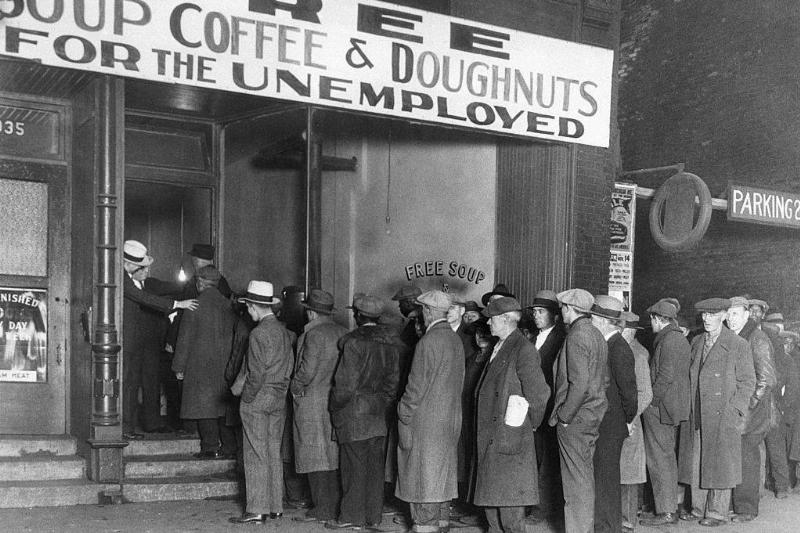 Men standing in line for food 