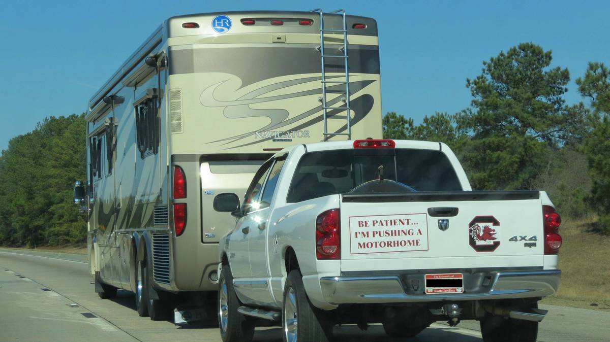 truck pushing a motorhome sticker