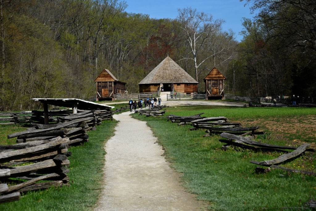 students walking into a barn in the forest of alexandria, virginia