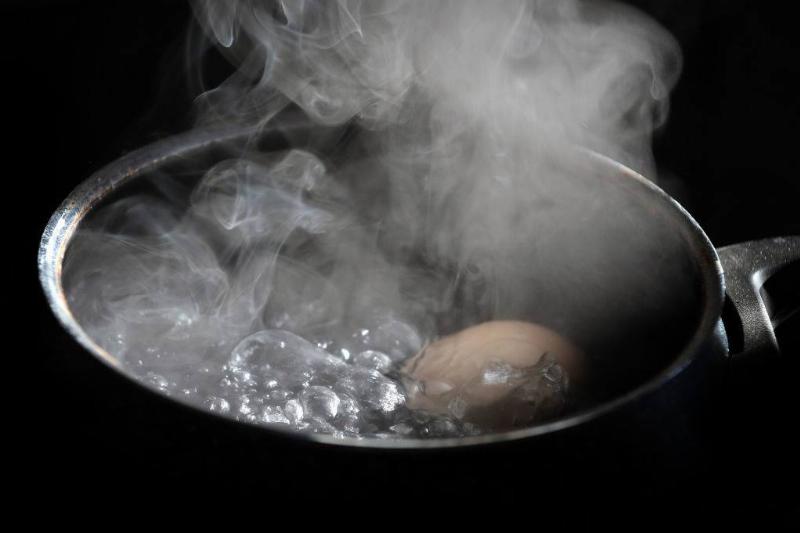 An egg lies in a pot