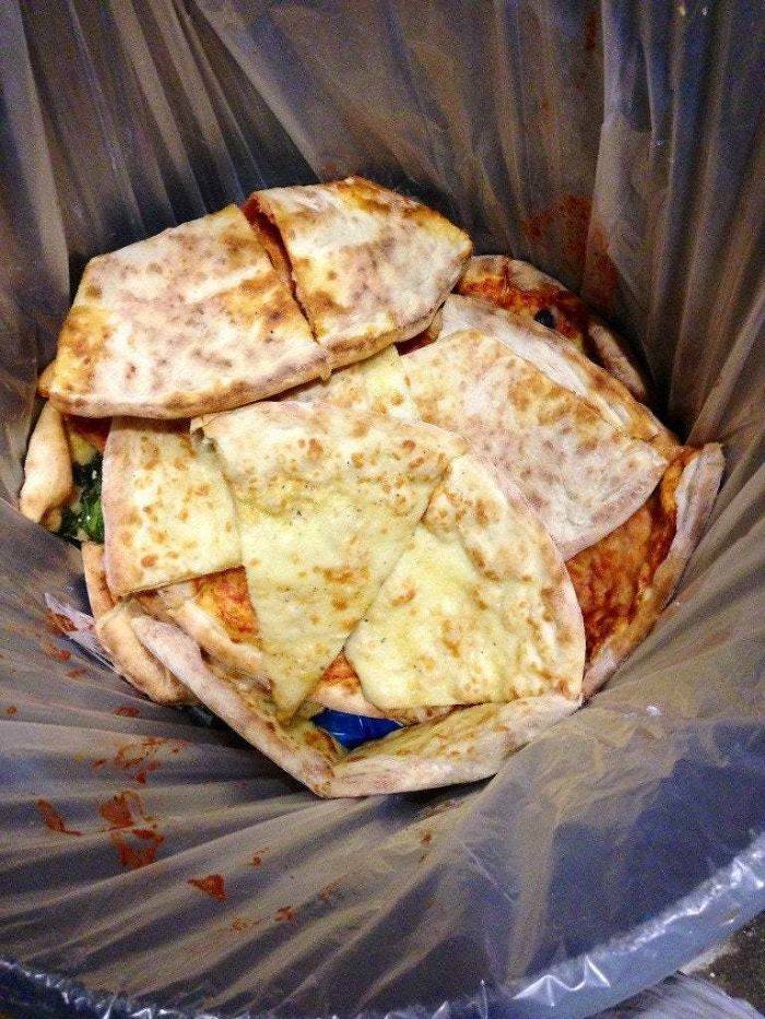 pizza in trash