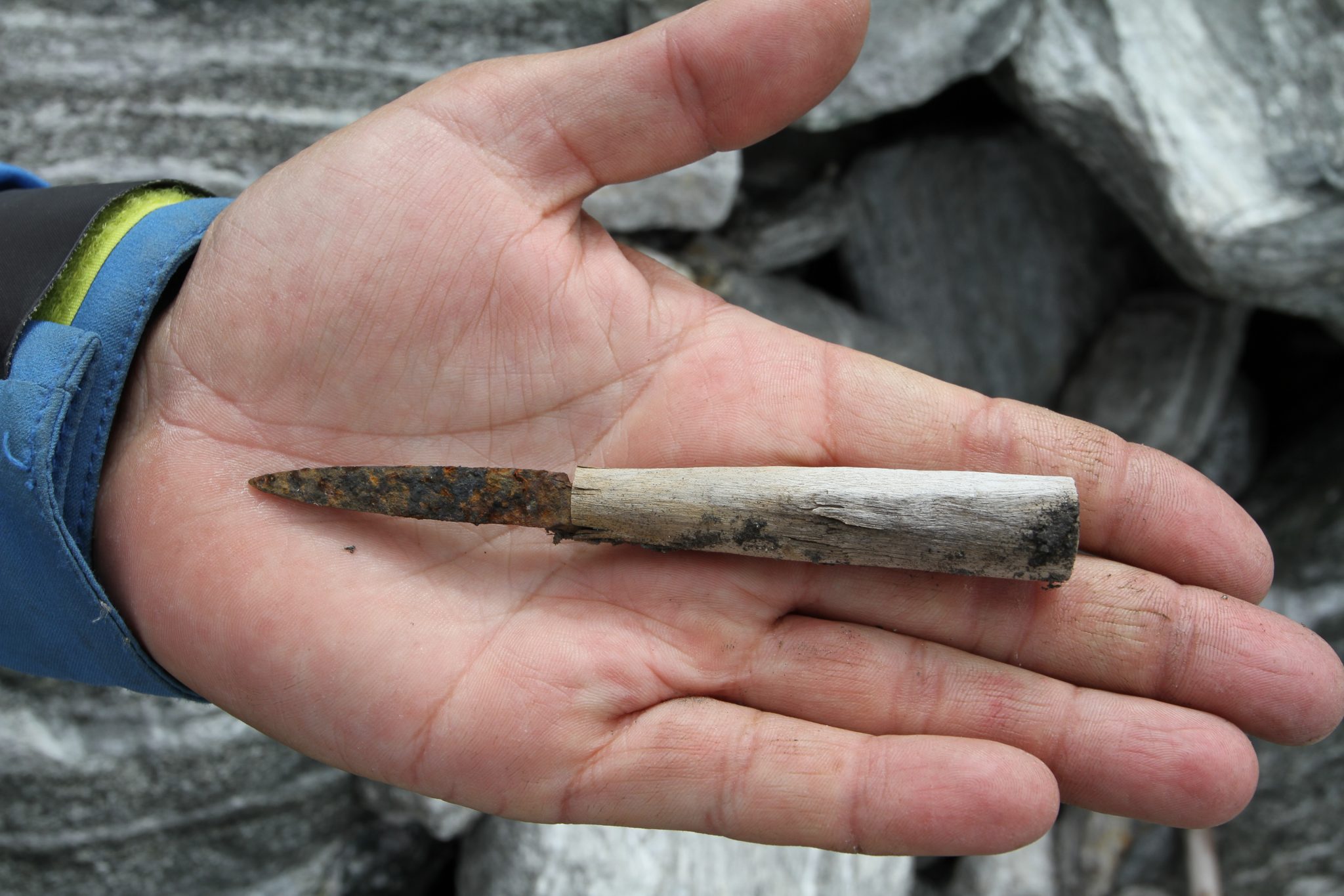 Knife: A small iron knife with a birchwood handle, found just below the pass area at Lendbreen. Radiocarbon-dated to the 11th Century AD. Photo: Espen Finstad, secretsoftheice.com.