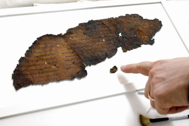 Pointing at the scrolls