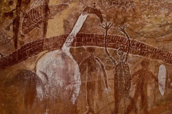 Panel of ancient rock art paintings of a rainbow serpent, white Ibis and human figures , at the Quinkan rock art site called, White Ibis Gallery, Quinkan Cave near Laura, Cape York, Queenland, Australia