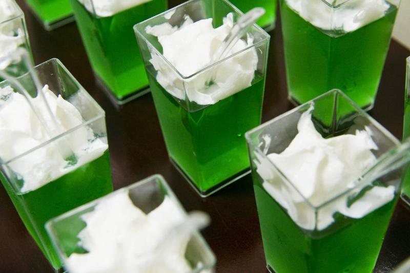 Containers of jello and cream are served as dessert.