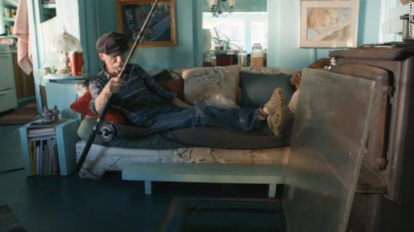 With a hole in the floor Wayne can even fish from the comfort of his sofa! Credit: Catherine King and Wayne Adams