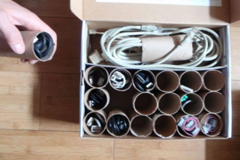using a box and toilet paper rolls for cords