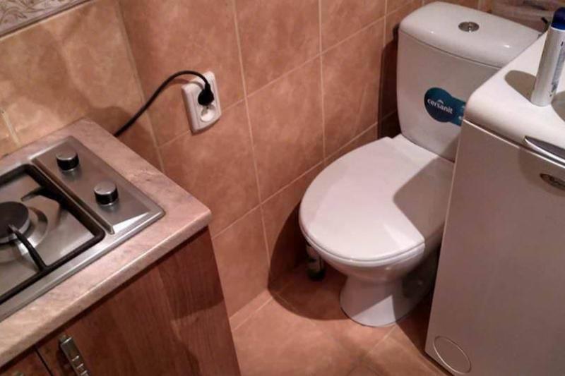 toilet right next to stove