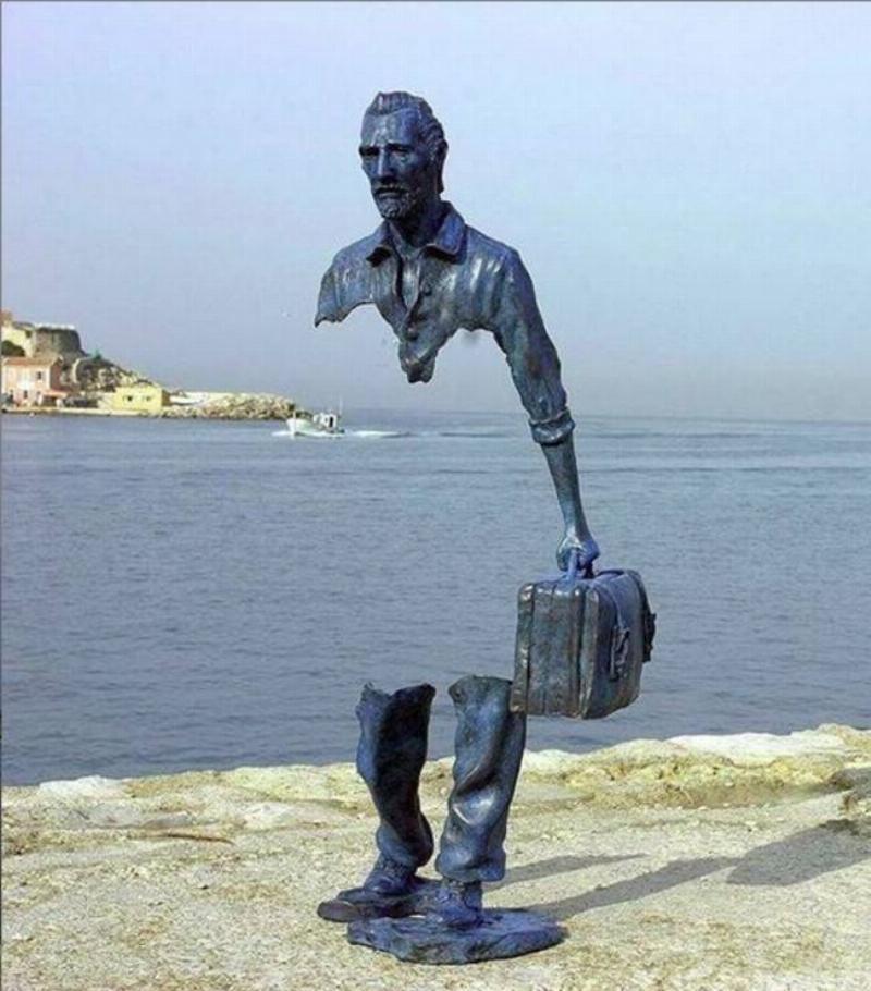 statue that's partially missing to symbolize immigrants leaving home