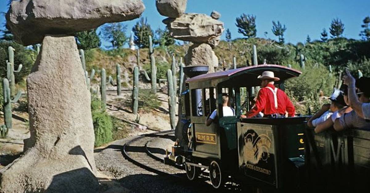 rainbow caverns mine train with passengers at disneyland