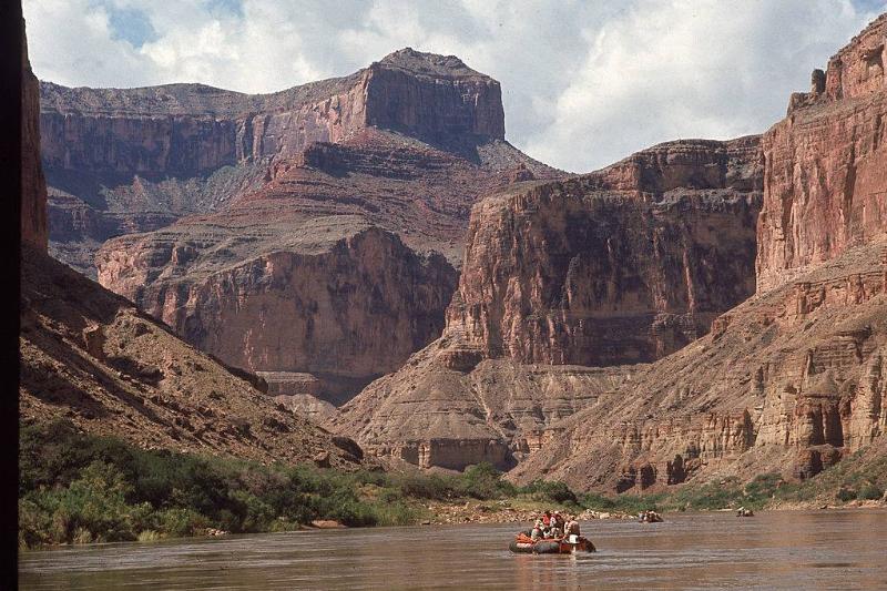 People paddling down the river 