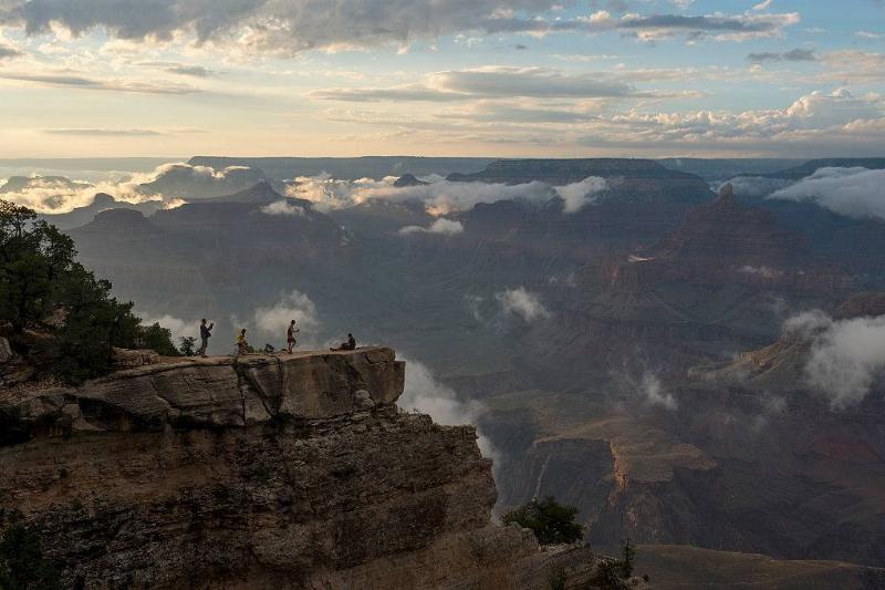 People On The Edge Of A Cliff 