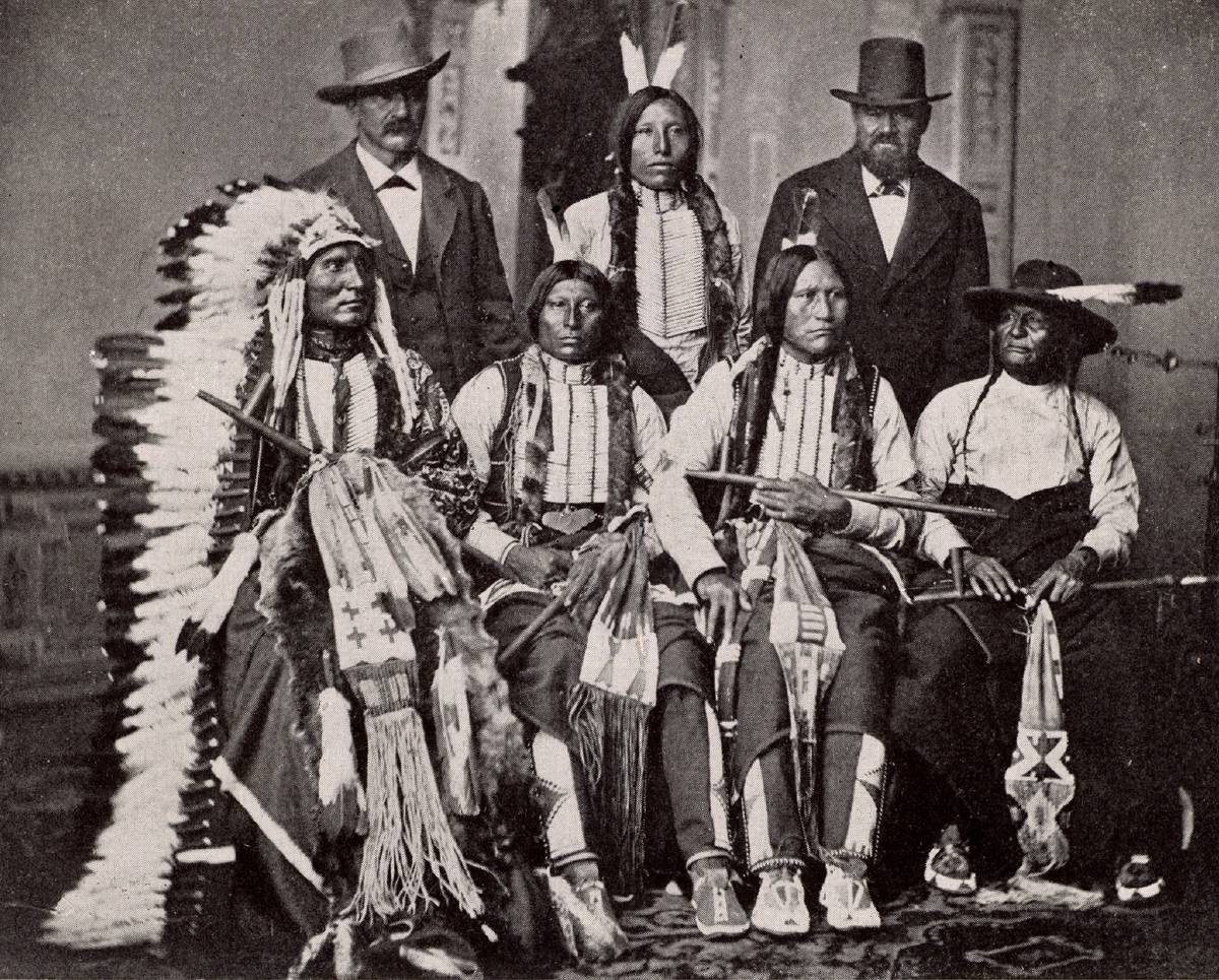 Explorers interact with Native Americans in this 19th century painting.