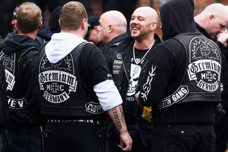 Members of the German biker club, Gremium, gather to chat.