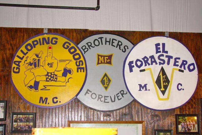 Signs featuring the Galloping Goose logos and insignias line a wall.