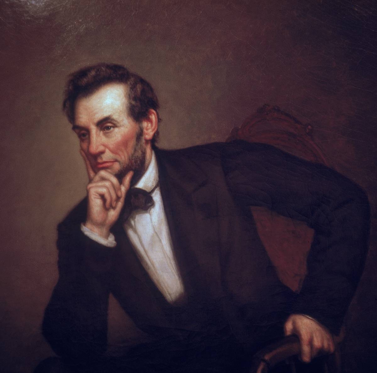 In this portrait by George Healy, President Lincoln leans forward and places his head on his hand.